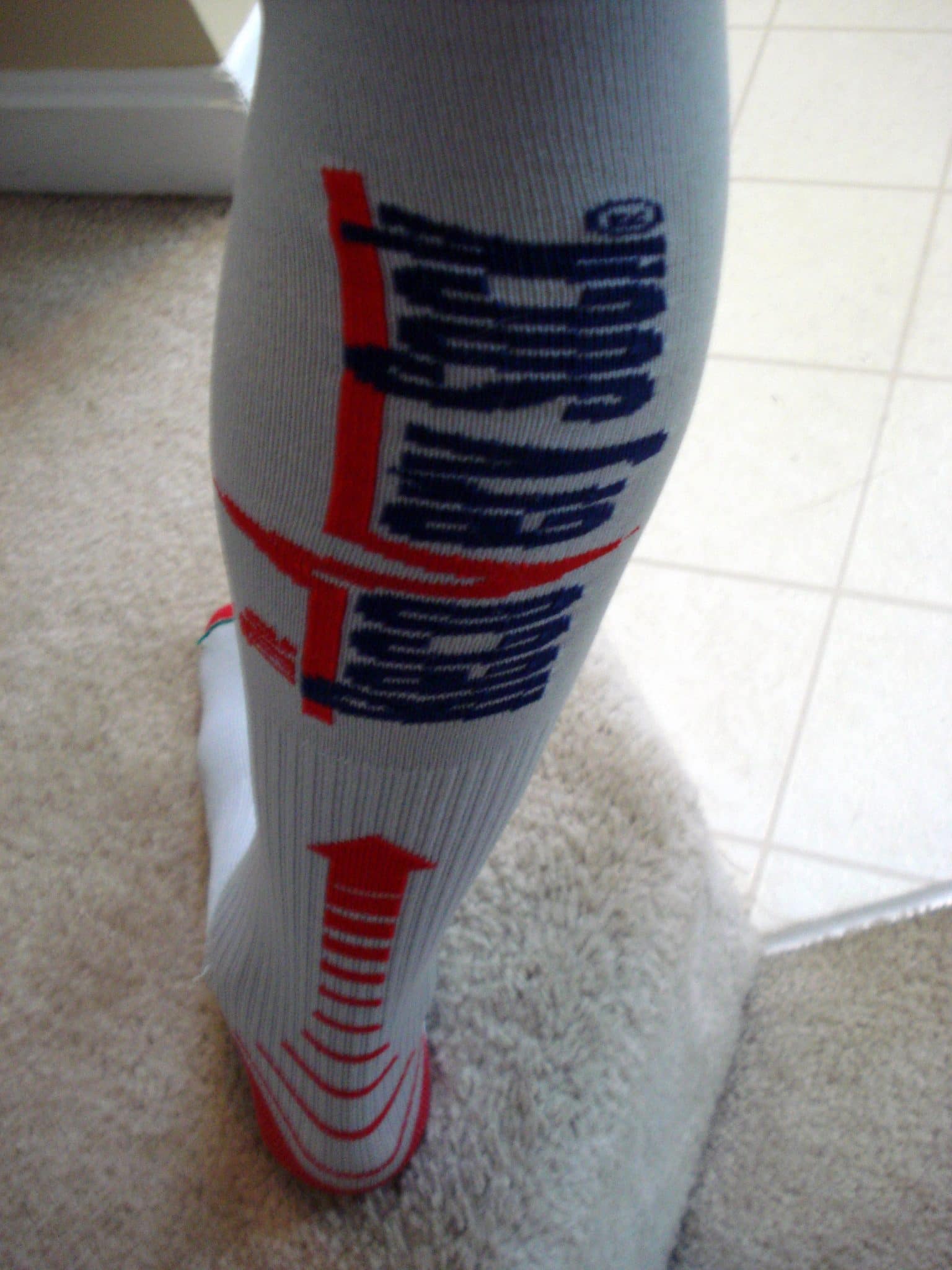 Man's leg wearing compression socks